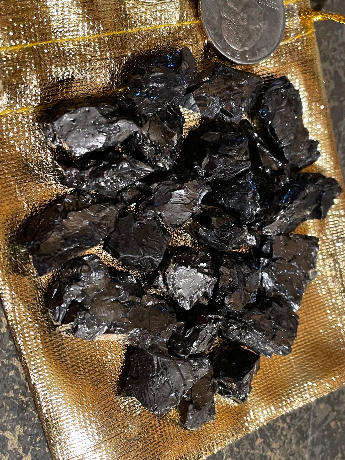 Elite Shungite pieces in gold pouch.