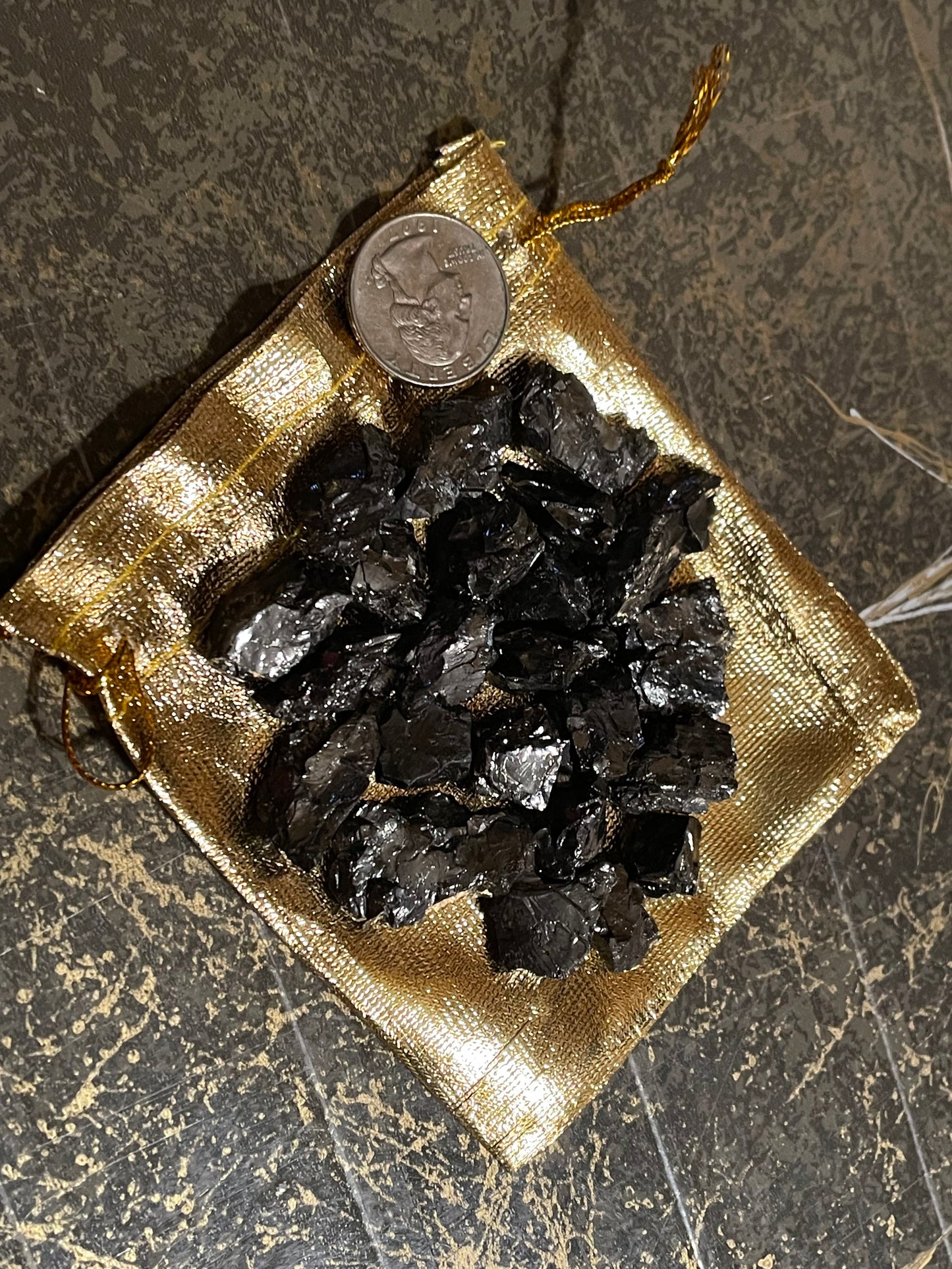 Elite Shungite pieces in gold pouch.